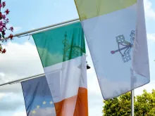 Dublin, Ireland - August, 2018: Vatican and Irish flags displayed in Dublin ahead of the arrival of Pope Francis at the 2018 World Meeting of Families. 