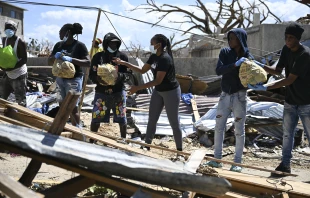 Residents help move food supplies at a community center before distribution to the Whitehouse community in Westmoreland, Jamaica, one of the areas most severely affected by the passage of Hurricane Melissa, on Nov. 2, 2025. Credit: Ricardo Makyn/AFP via Getty Images