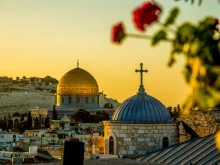 Dome of the Rock with Christian church in foreground in Jerusalem.