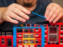 John Kraemer lays a brick while constructing his latest church.