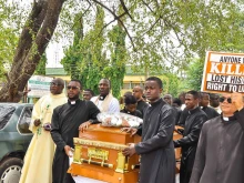 Priests protest at the funeral of Father Vitus Borogo in the archdiocese of Kaduna on June 30, 2022.