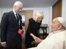 Pope Francis greets England’s King Charles and Queen Camilla on April 9, 2025, at the pope’s private residence in the Vatican. 