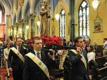 The statue of Father McGivney is carried in procession at the conclusion of Mass at St. Mary's in New Haven. Photo courtesy of the Knights of Columbus. 