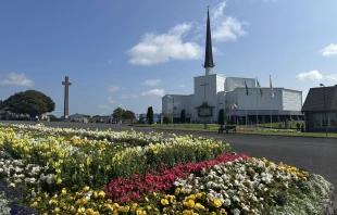 Flowers stand before Knock Shrine in Knock, Ireland, Friday, Aug. 15, 2025 Credit: Courtney Mares/CNA