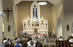 The faithful pray before the altar at Knock Shrine in Knock, Ireland, Friday, Aug. 15, 2025. Credit: Courtney Mares/CNA
