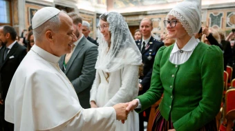 Pope Leo XIV greets pilgrims from Latvia on Nov. 24, 2025, at the Vatican.