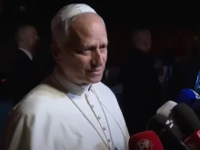 Pope Leo XIV answers questions during an impromptu Q&A with journalists outside Castel Gandolfo on Sept. 30, 2025.