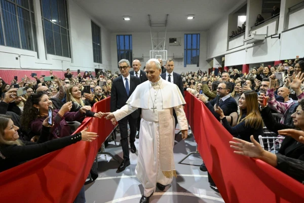 The pope greets the children's families. Credit: Vatican Media