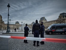French Police officers seal off the entrance to the Louvre Museum after a jewelry heist on Oct. 19, 2025, in Paris.