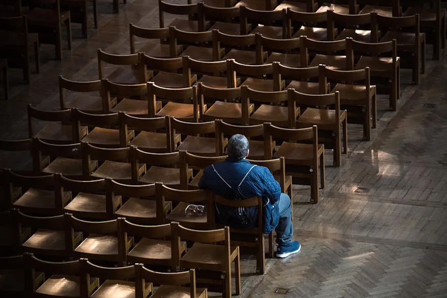 A man prays in Westminster Cathedral on March 22, the first Sunday without public Mass in the UK.  ?w=200&h=150