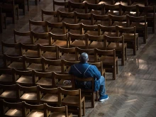A man prays in Westminster Cathedral on March 22, the first Sunday without public Mass in the UK.  