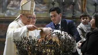 Pope Leo XIV baptizes a child in the Sistine Chapel at the Vatican on the feast of the Baptism of the Lord, Jan. 11, 2026.