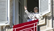 Pope Leo XIV greets pilgrims gathered in St. Peter's Square at the Vatican for the recitation of the Angelus on Jan. 11, 2026.