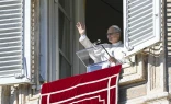 Pope Leo XIV greets pilgrims gathered in St. Peter's Square at the Vatican for the recitation of the Angelus on Jan. 11, 2026.