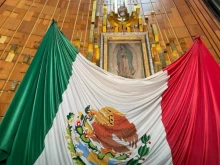 The original image of Our Lady of Guadalupe with the Mexican flag.