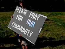 Nurses who are on strike hold signs in support of the community following a shooting and fire at the Church of Jesus Christ of Latter-day Saints in front of Henry Ford Genesys Hospital on Sept. 29, 2025, in Grand Blanc, Michigan.