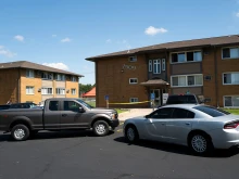 Law enforcement vehicles sit parked outside a reported residence of a suspect following a mass shooting at Annunciation Catholic School on Aug. 27, 2025 in Richfield, Minnesota.