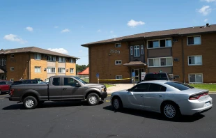 Law enforcement vehicles sit parked outside a reported residence of a suspect following a mass shooting at Annunciation Catholic School on Aug. 27, 2025 in Richfield, Minnesota. Credit: Stephen Maturen/Getty Images
