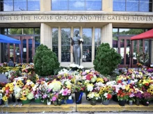 Flowers are seen on Sept. 3, 2025, outside the Annunciation Catholic Church in Minneapolis, where a shooter killed two children and injured 21 other people on Aug. 27, 2025.