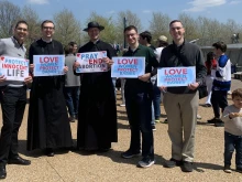 Marchers hold pro-life signs at the Missouri March for Life in St. Louis on Saturday, April 12, 2025.