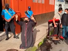 Bishop Rolando Álvarez of Matagalpa, Nicaragua, is monitored by police in early August 2022.