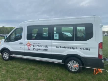 Small white vans dubbed "monstrance mobiles" are being used for the National Eucharistic Pilgrimage. They are just big enough for some of the "perpetual pilgrims" and a pedestal upon which Christ in the monstrance can be placed.