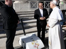 Pope Leo XIV receives an electric lawn mower from Czech manufacturer Swardman during a general audience in mid-November 2025.