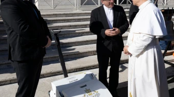Pope Leo XIV receives an electric lawn mower from Czech manufacturer Swardman during a general audience in mid-November 2025.