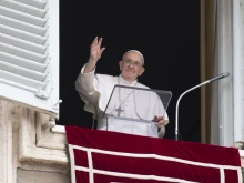 Pope Francis waves to pilgrims gathered in St. Peter's Square for the Regina Caeli on May 8, 2022.