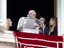 Pope Francis registers for World Youth Day 2023 at the end of his Angelus address on Oct. 23, 2022.