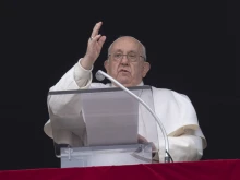 Pope Francis gives a blessing after he delivers his Angelus address to pilgrims gathered in St. Peter’s Square on Dec. 26, 2023.