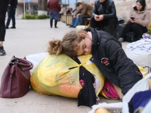 A girl sleeps in a street in the town of Stepanakert on Sept. 25, 2023. Ethnic Armenian refugees began to leave Nagorno-Karabakh on Sept. 24, 2023, for the first time since Azerbaijan launched an offensive designed to seize control of the breakaway territory and perhaps end a three-decade-old conflict.