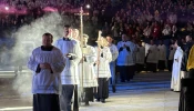 Priests process into Lucas Oil Stadium on Nov. 22, 2025, for the concluding Mass in Lucas Oil Stadium at the National Catholic Youth Conference in Indianapolis.