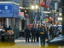 FBI investigators arrive at the scene where a pickup truck crashed into a work lift after allegedly driving into a crowd of New Year’s revelers in the French Quarter of New Orleans on Jan. 1, 2025.