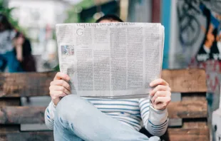 Man reading the newspaper /   Roman Kraft on Unsplash