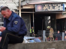 Firefighters and police officers inspect the nightclub where a fire broke out overnight in Kocani, a town some 62 miles east of the capital Skopje, on March 16, 2025. A fire tore through an overcrowded nightclub packed with mostly young people in North Macedonia overnight, killing 59 people, apparently after on-stage fireworks at a hip-hop concert set the venue ablaze, authorities said.