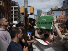 Father Fidelis Moscinski (far left, in gray robe), a well-known pro-life activist and priest of the Franciscan Friars of the Renewal (CFR), is seen during a tense standoff between pro-life and pro-abortion demonstrators in Lower Manhattan on July 2, 2022.