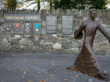 Msgr Hugh O'Flaherty bronze memorial by Alan Ryan Hall, located on Mission Road, Kilarney, Ireland. 
