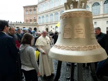 Pope Francis blesses the bell in the San Damaso courtyard at the Vatican, Sept. 23, 2020. 