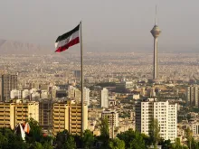 Tehran skyline with flag. 