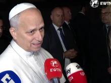 Pope Leo answers questions from journalists as he leaves Castel Gandolfo to return to the Vatican on Nov. 4, 2025.