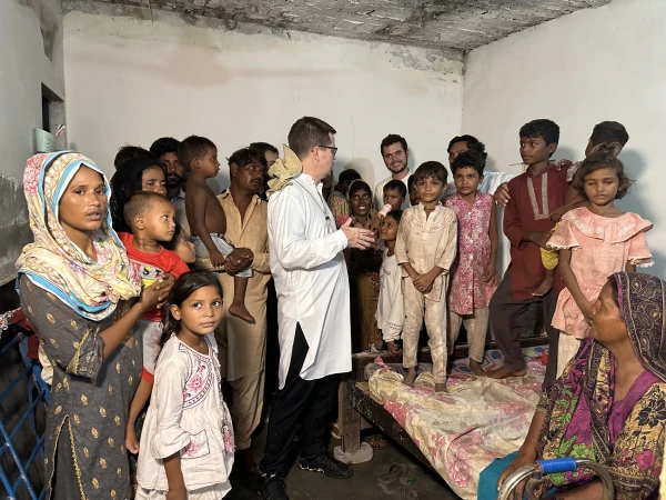 Father Rico is pictured with Christian children and family members in Pakistan whom he has ransomed from debt bondage. According to the U.N., between 3.5 million and 5 million people are engaged in bonded or forced labor in which whole families are compelled to work. Credit: Photo courtesy of the Order of St. Elias