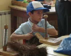 A student makes a broom at the Al-Ala'iya School for the Blind?w=200&h=150