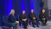 Maura Moser (far left), director of the Catholic Communications Campaign, moderates a discussion on immigration with (left to right) Archbishop Timothy P. Broglio, president of the United States Conference of Catholic Bishops; Bishop Kevin C. Rhoades, chair of the USCCB's religious liberty committee, and Bishop Mark Seitz, chairman of the USCCB's migration committee, on Nov. 11, 2025, during a press conference at the conference's fall plenary assembly in Baltimore.