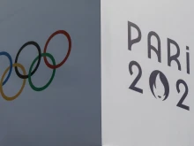 A banner bears the signs of the 2024 Paris Olympic Games and the Olympic Rings at the Trocadero in Paris on July 14, 2024.