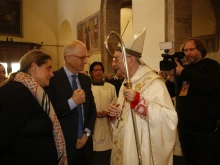 Cardinal Pietro Parolin greets the parents of St. Carlo Acutis before Mass at Church of Santa Maria Maggiore in Assisi, Italy, on Oct. 12, 2025.