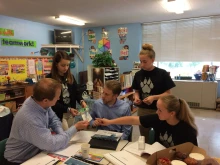 Former St. Peter Middle School students meet with patent attorneys from Foley and Lardner.