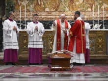 Pope Francis blesses the coffin of Cardinal George Pell at the Australian prelate's funeral Mass in St. Peter's Basilica on Jan. 14, 2023.