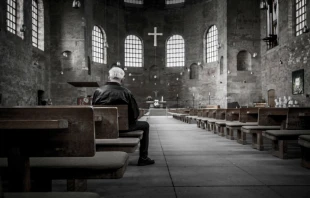Man in the pews /   Stefan Kunze on Unsplash 