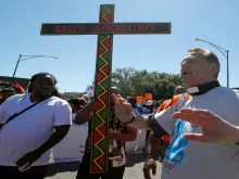 Fr. Michael Pfleger leads an anti-violence protest shutting down the Dan Ryan Expressway in Chicago, July 7, 2018.  